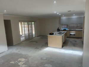 Bare concrete slab prepared for flooring installation and moisture testing