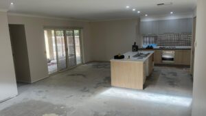 Bare concrete slab prepared for flooring installation and moisture testing