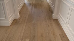 Engineered oak flooring in an entry hallway with wainscoting and a black front door