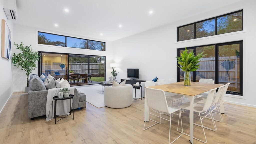 Laminate flooring in a bright open plan living and dining room in South East Melbourne